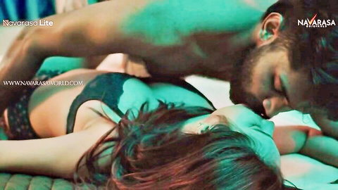 Indian couple in passionate erotic kiss, woman in black lingerie