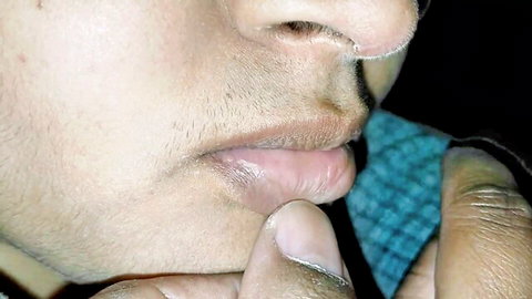 Close-up of intense Indian man's face with mustache during adult scene