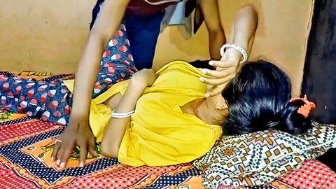 Indian cute girl in yellow saree touched by step-brother on bed