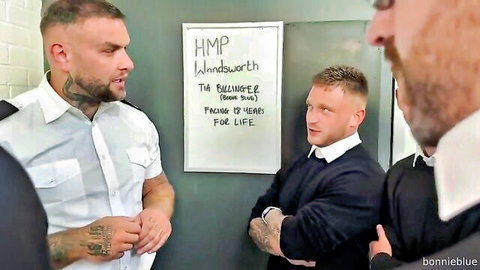 Bonnie Blue in prison-themed gangbang with tattooed muscular men