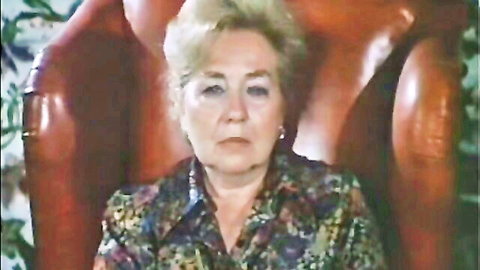 Mature blonde woman in floral blouse, vintage 1981 retro porn thumbnail