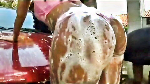 Ebony babe with huge soapy bubble butt bent over washing red car outdoors
