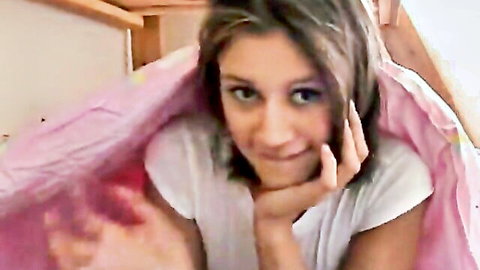 Trixie teases with smile in solo POV bed scene