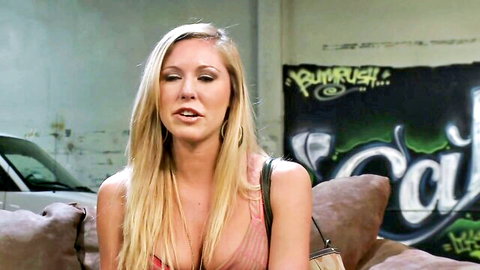 Hot blonde teen with big boobs in low-cut top on couch