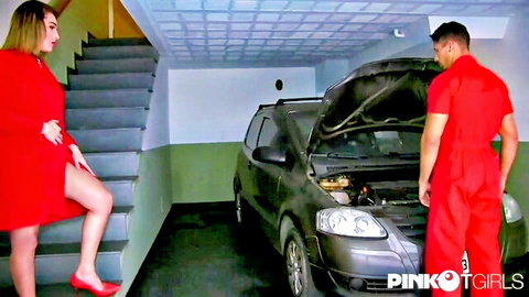 Tgirl in red dress seduces mechanic by car in garage