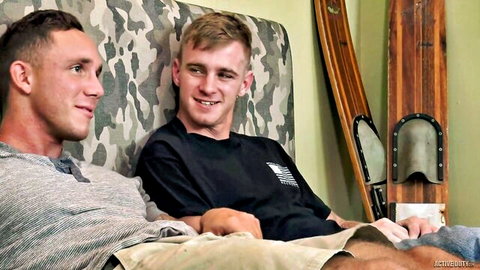 Two young athletic men smiling blissfully together in gay scene at Love Trans Sex