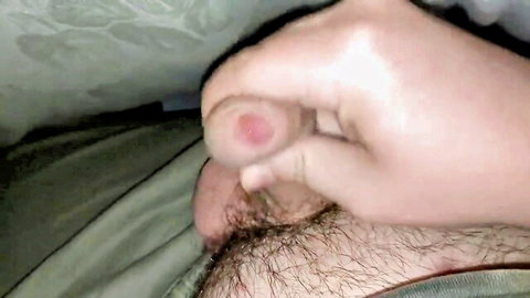 Close-up of man stroking erect penis in solo handjob