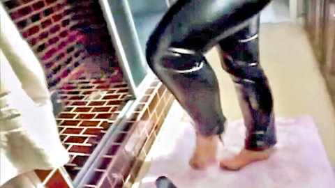 Luissa in shiny black leather pants, barefoot teasing pose