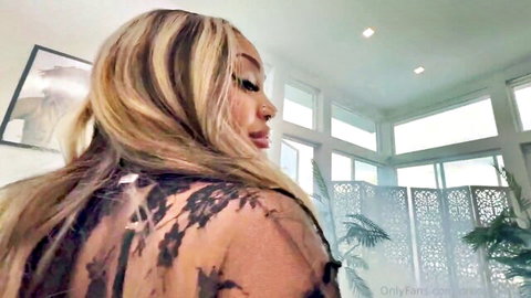 Brandi Sheri in sheer black lace top, blonde hair tease from behind