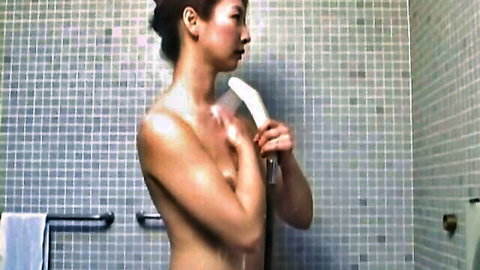 Slender Japanese MILF nude in shower room close-up