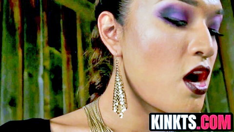 Brunette with purple eyeshadow and glossy lips wide open for deep throat blowjob
