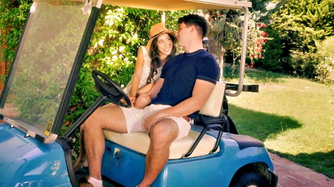 Eva Generosi playful teen kissing guy in golf cart outdoor tease