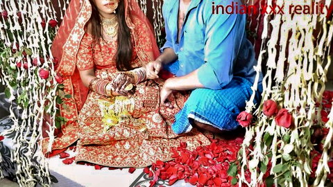Indian bride in red saree and groom in traditional attire on wedding swing, desi step mom fantasy