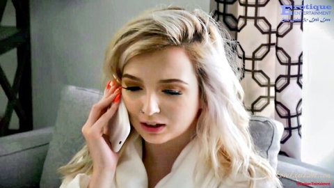 Lexi Lore blonde in white robe on intense phone call