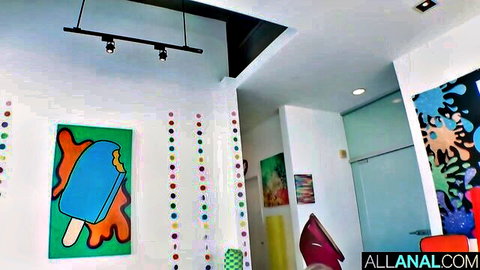 Colorful pop art room with giant blue popsicle painting, garlands and modern decor at AllAnal.com studio