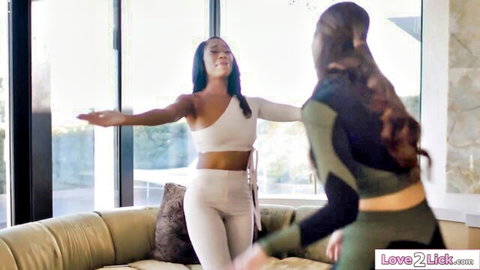 Ebony and Asian women in sexy outfits teasing together, lesbian vibe
