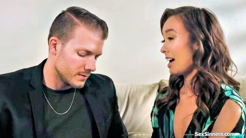 Christy Love in low-cut green dress chatting intimately with man