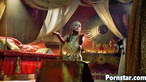 Priya Rai in glamorous exotic attire posing seductively on bed