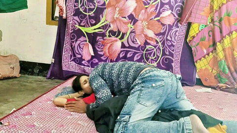 Indian desi couple in intimate spooning embrace on floor