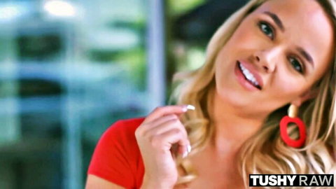 Smiling blonde in red top and hoop earrings for Tushy Raw blonde compilation