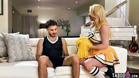 Spencer Scott in cheerleader outfit with stepson on couch