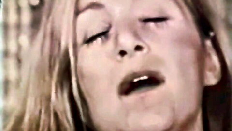 Close-up of blonde retro pornstar moaning in ecstasy from 1970s film