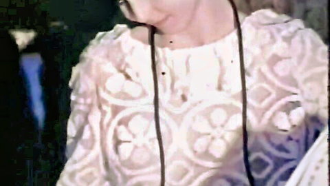 Woman in sheer lace blouse revealing her perky tits and nipples through transparent fabric