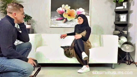 Hijab-wearing amateur Muslim babe posed with cameraman for explicit action
