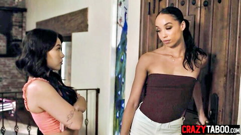 Black teen in pink top chats with mixed-race friend in tube top and pants, teasing rough anal preview