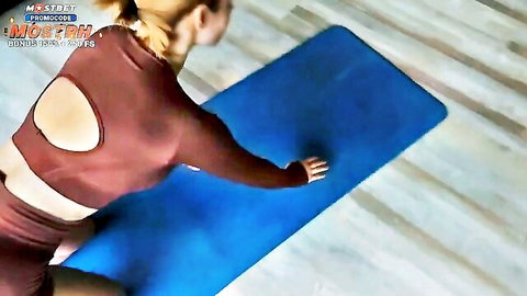 Blonde woman in tight maroon gym outfit bending over in yoga pose on mat
