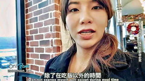 Korean woman vlogging in restaurant, teasing OnlyFans sex content