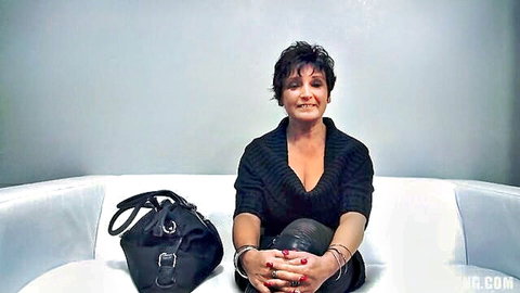 Mature Czech housewife in handcuffs, smiling with cleavage, debuting in adult industry