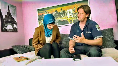 Muslim hijab MILF in blazer chats with police officer on couch