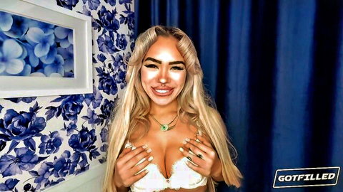 Luna Luxe blonde in white bra, teasing with her large breasts