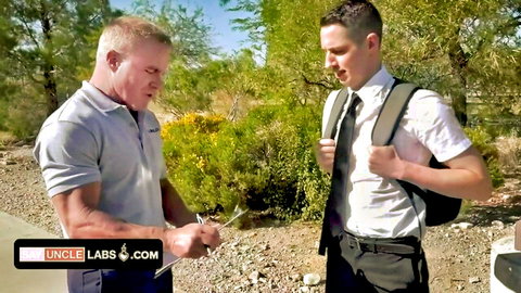 Muscular older man in polo chats with young suited Mormon missionary outdoors