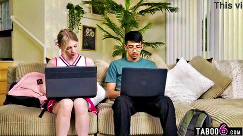 Petite cheerleader Melody Marks with Diego Perez on couch with laptops