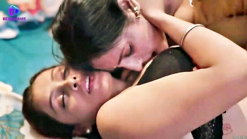 Two busty Indian brunettes passionately French kissing in lingerie on bed