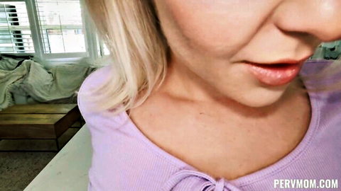 Sensual blonde MILF in purple top, seductive POV close-up