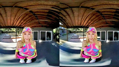 Blonde babe in Barbie parody colorful leotard squatting teasingly