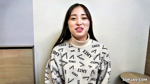 Smiling Asian woman in white Emily sweater, long black hair, JAV style thumbnail