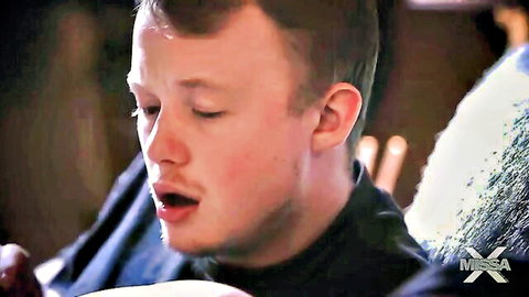 Young man in black turtleneck, intense expression with Jennifer White in mommy taboo scene