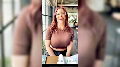 Alexis Fawx smiling seductively in POV hot video, redhead MILF in tank top