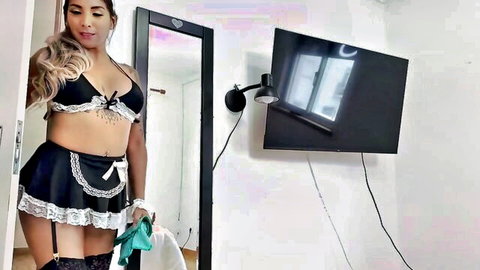 Curvy Latina in sexy black maid lingerie bends over flashing big ass and cleavage in mirror