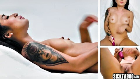 Tattooed brunette babe with small tits masturbates shaved pussy with pink dildo closeup nude solo