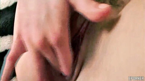 Close-up of raunchy vixen's wet pussy spread by fingers in steamy solo tease