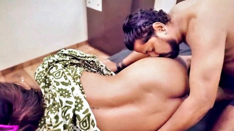 Passionate Indian MILF in emotional nude embrace, kissed from behind by muscular lover