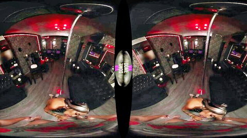 Nude woman in VR headset lying on floor in red-lit lounge, explicit solo XXX tease