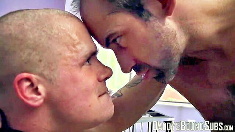 Bald sub Cullen Cable in pain faces bearded daddy in BDSM torment