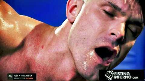 Sweaty muscular jock in intense near-naked wrestling match, mouth open in ecstasy
