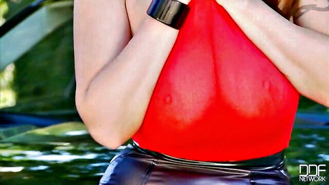 Busty curvy MILF in sheer red top exposing huge tits and hard nipples against car